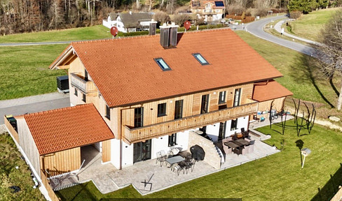 Semi-detached house in a green area.