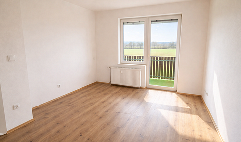 Modern 2-room apartment with a south-facing balcony and carport in Lieboch – with a view of greenery and excellent transport links.
