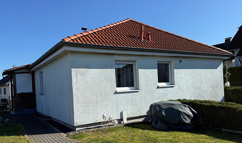 Modern living on one level: a bright and airy bungalow on a sunny corner lot!
