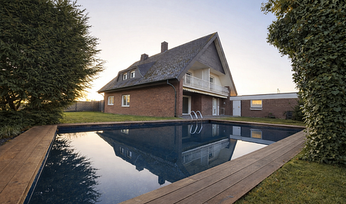 High-quality two- to three-family house with a variety of potential uses.