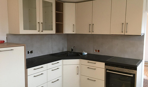 Centrally located, newly renovated apartment with a garden.