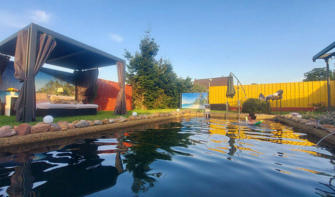 Nature paradise near Ludwigslust – swimming pond, koi pond, and workshop, also suitable for commuters from Hamburg and Berlin.