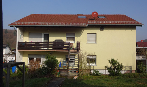 Partially renovated two-family house, located in the quiet area of Wiesenbach, with a spacious garden.