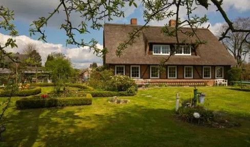 Old thatched-roof cottage.