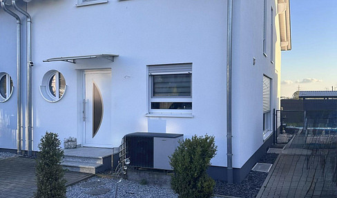 Modern semi-detached house in Pfungstadt, energy efficiency class A+, ready for occupancy, with a terrace featuring a glass roof.