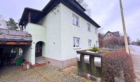 Multi-family house & detached house with loft, featuring underfloor heating, including a garage and carport.