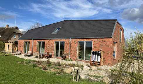 Detached house near the Baltic Sea, offering panoramic views of meadows and fields.