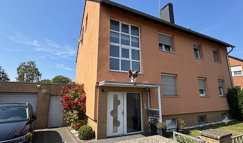 Well-maintained apartment building with three residential units.