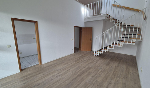 Modern, renovated apartment with gallery, including underground parking and an outdoor parking space.