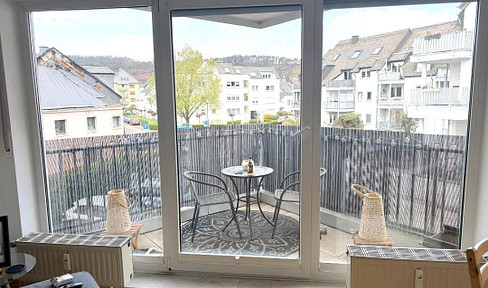 Charming 2-room apartment with a balcony and parking space, located in a quiet area near the city center.