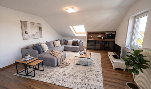 Well-maintained 2-room apartment with balcony and parking space, located in the attic – ideal for singles and commuters (close to the A3 motorway).