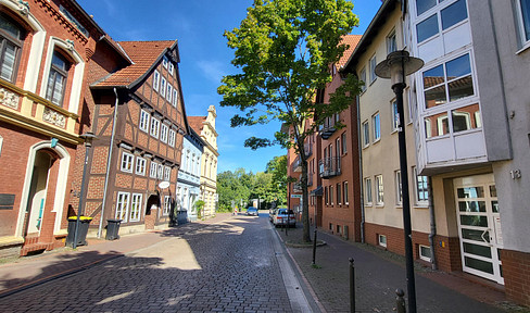 3-room apartment with kitchen and parking space in a garage, including a wallbox for electric vehicle charging.