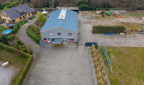 Versatile commercial property in Wietmarschen, district of Lohne: warehouse, office space, and residential building.