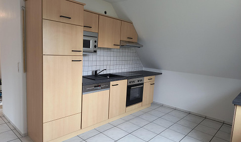 Bright, renovated 2-room attic apartment with garden access, located in Satrup.