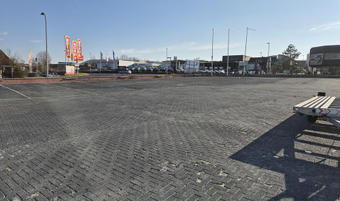 Commercial land, parking space, building plot, fully developed and paved, with a washing area.