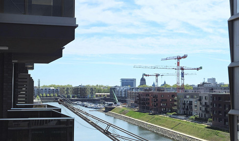 High-quality 3-room apartment in the Mainz Zollhafen district, brand new and never occupied, located in a new building, with underground parking - "Living by the water."