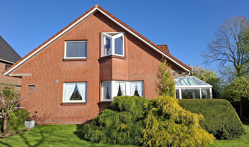 Fully basemented single-family house with a sunroom and solar panels.