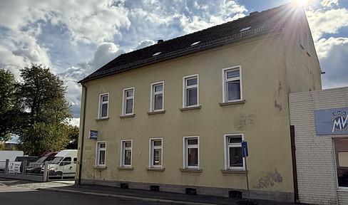 Multi-family building with versatile residential and commercial spaces.