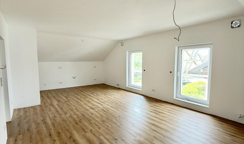 Modern, newly built penthouse apartment with its own entrance, located in a quiet, central area of Neulußheim.