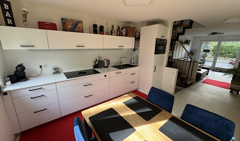 Live like you're in a house: Modern maisonette with garden, rooftop terrace, and underground parking.
