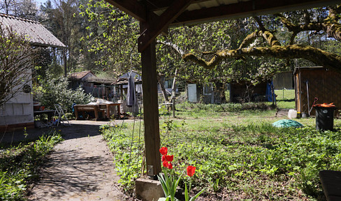 Charming, fully enclosed weekend property with a brick garden shed.