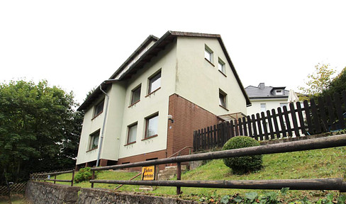 Multi-family house with 3 residential units and significant development potential.