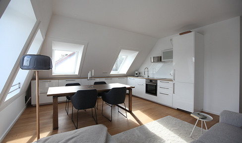High-quality, modern penthouse apartment with mountain views and a bright, airy living space.