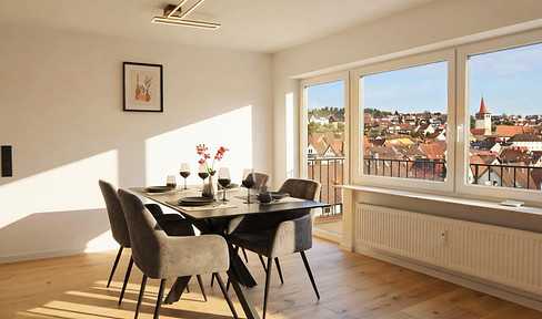 Renovated 4-room apartment with balcony and stunning views.