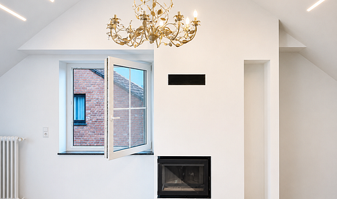 Exclusive 3-family house with a luxury ground-floor apartment, conservatory, and 2 garages, located in Korschenbroich.