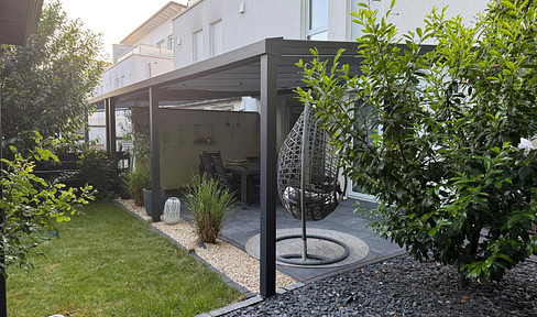 Modern semi-detached house located on the edge of a field, with a covered south-facing terrace, in Nieder-Olm.