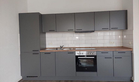 Spacious loft apartment with a new fitted kitchen and balcony.