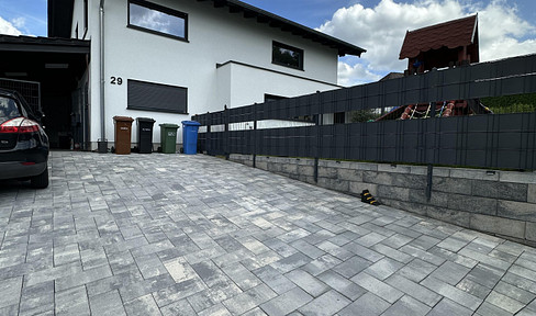 Modern single-family house with smart home technology and high-quality finishes, located in a quiet area near Linz am Rhein.