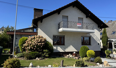 Bright family home with a large garden, located in a quiet residential area, with excellent transport links.