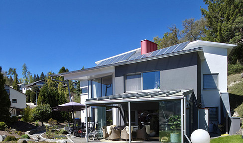 High-quality architect-designed house with a conservatory, pond, and a 1,541 m² plot of land, located in Tailfingen, Albstadt.