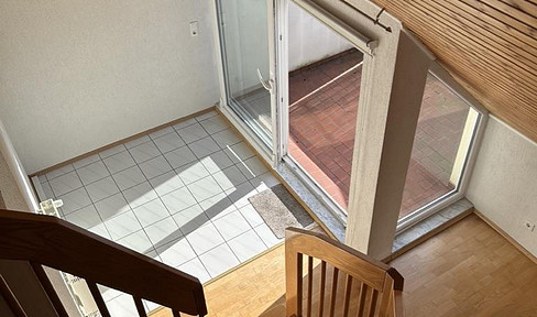 Duplex apartment with a mezzanine level, balcony, and underground parking space – renovated and available immediately.