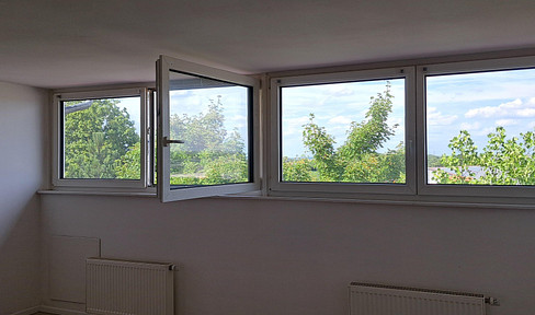 One-room attic apartment with fitted kitchen, bathroom, and hallway.