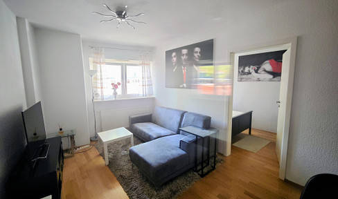 Modern, furnished studio apartment.
