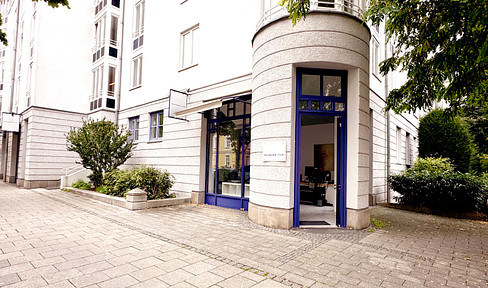 Charming commercial space with outdoor area, underground parking, and 2 storage rooms - ideal for a daytime café (no commission).
