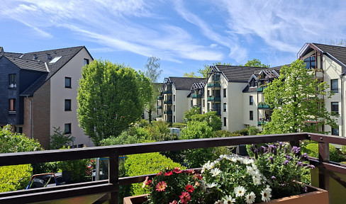 Trills: Renovated 3-room apartment with balcony and underground parking space – high-quality and flooded with light!