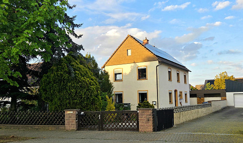 Energy-efficient single-family home with a large garden on a 911 m² plot of land.