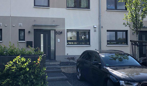 A modern, smart family home with a fitted kitchen, located in a quiet area of Cologne-Roggendorf.