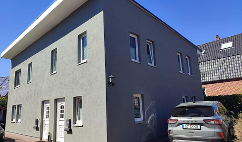 Charming duplex house with two separate living units.