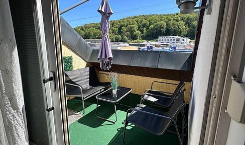 Sunny 3-room attic apartment (non-smoking) with a balcony, located in the eastern part of the city, near OBI (a home improvement store), LGH (likely a local landmark or business), and with a driveway.