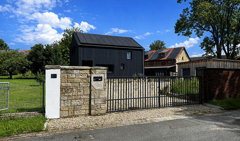 Unique property featuring a new residential building, riding arena, and versatile areas for various uses.