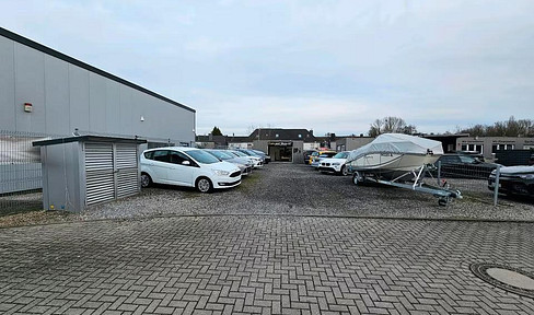 Car dealership - Car sales lot - Car rental - Sales area - Open space.