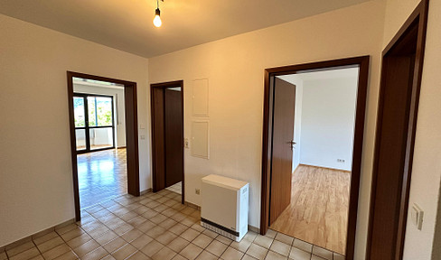 Charming 3-room apartment with a balcony, underground parking space, and fitted kitchen.