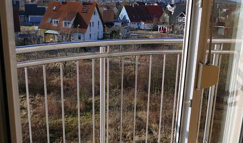 Bright 4-room apartment with a balcony, fireplace, and parking spaces, located in a quiet, central area of Hirschaid.