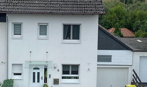 Charming terraced house with a conservatory and fireplace in Niederrodenbach.