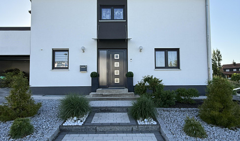 Modern single-family house with a separate apartment.