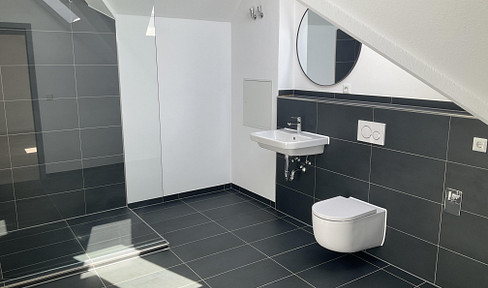 Newly renovated maisonette apartment with a balcony, elevator access, and a parking space in an underground garage.